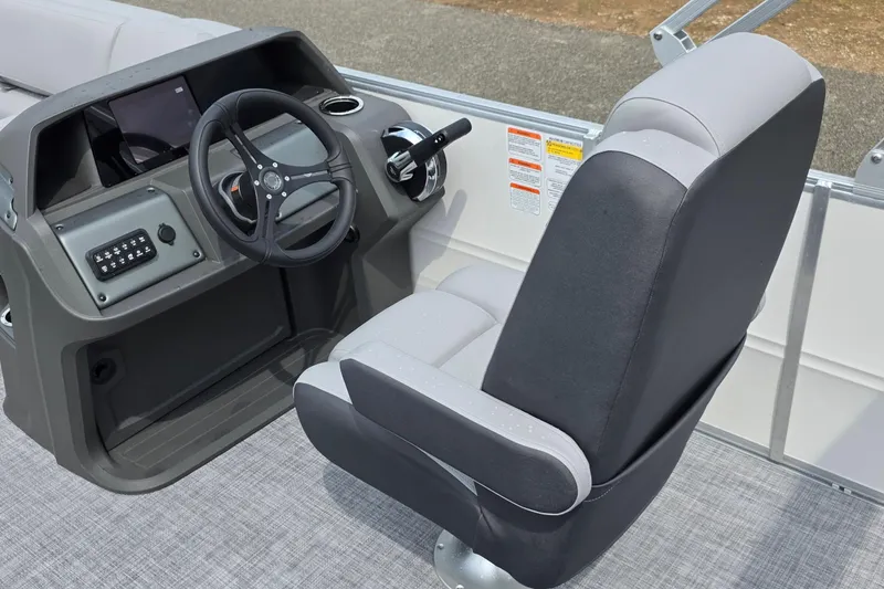 Slide: The Image of 2026 Sun Tracker Party Barge 20 DLX helm with steering wheel and captain's chair. - 10