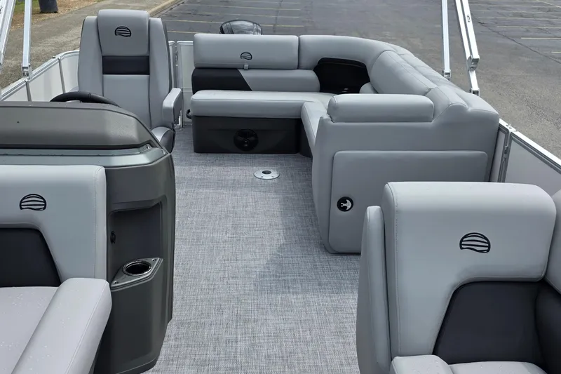Slide: The Image of 2026 Sun Tracker Party Barge 20 DLX interior with gray seating and spacious layout. - 15