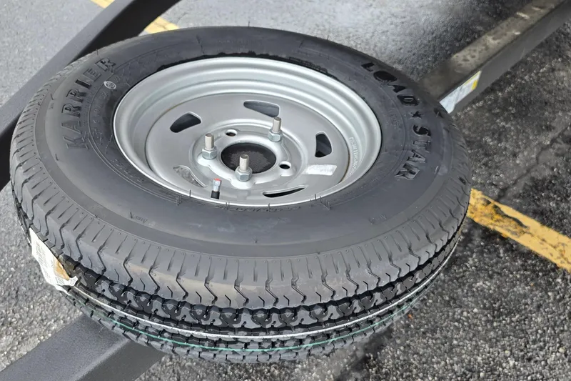 Slide: The Image of Spare tire on Sun Tracker Party Barge 20 DLX trailer, 2026 model. - 19