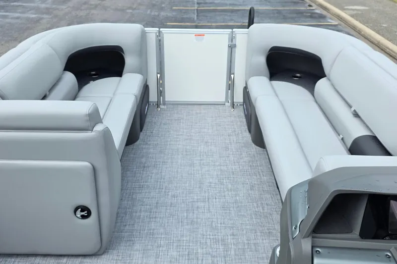 Slide: The Image of 2026 Sun Tracker Party Barge 20 DLX interior with gray seating and spacious layout. - 8