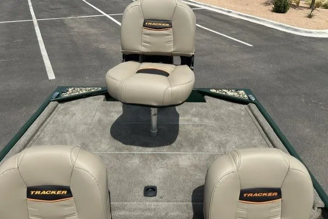 Slide: The Image of 2026 Tracker Bass Tracker Classic Limited boat seats in a parking lot. - 19