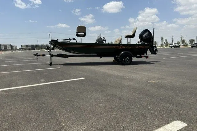 The Image of 2026 Tracker Bass Tracker Classic Limited boat in a parking lot under a cloudy sky. - 0