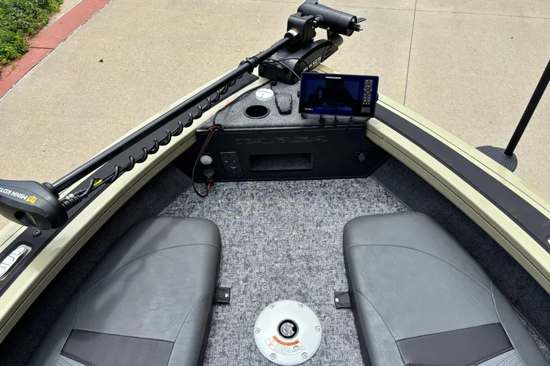 Slide: The Image of 2026 Tracker Targa V-18 Combo boat interior with seats, control panel, and navigation equipment. - 3