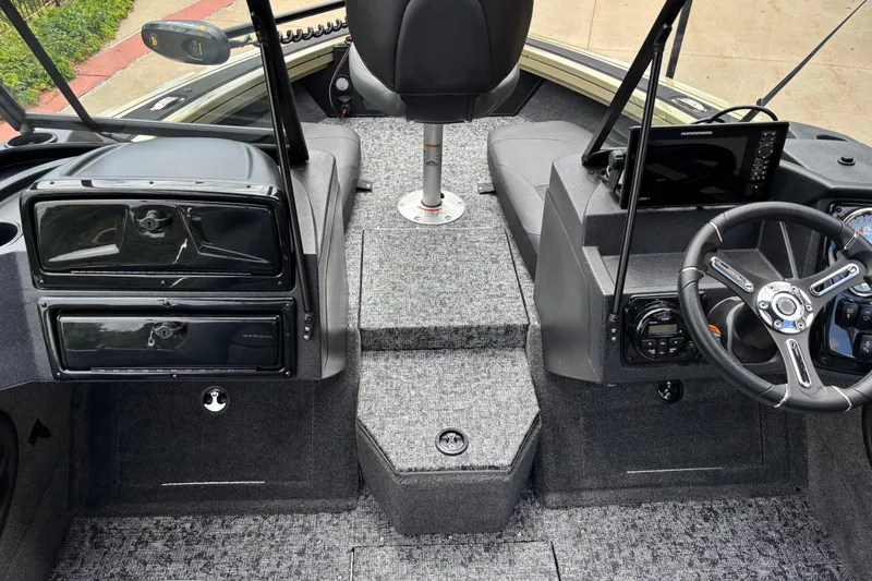Slide: The Image of Interior view of 2026 Tracker Targa V-18 Combo boat cockpit with steering wheel and controls. - 5
