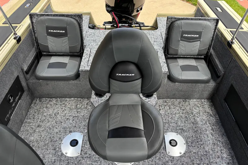 Slide: The Image of 2026 Tracker Targa V-18 Combo boat interior with gray seating and carpeted flooring. - 6