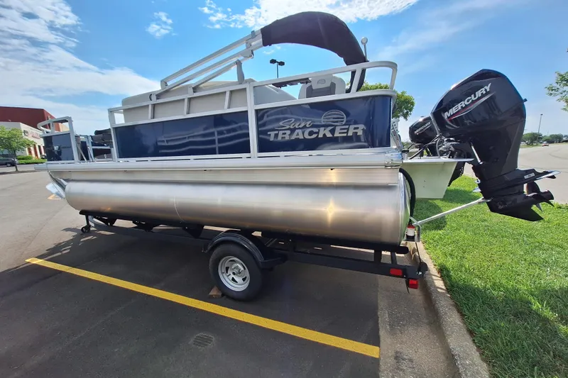 Slide: The Image of 2026 Sun Tracker Bass Buggy 18 DLX pontoon boat with Mercury outboard motor. - 3