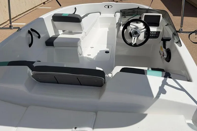 Slide: The Image of 2026 Tahoe T16 boat interior with modern steering and seating arrangement. - 1