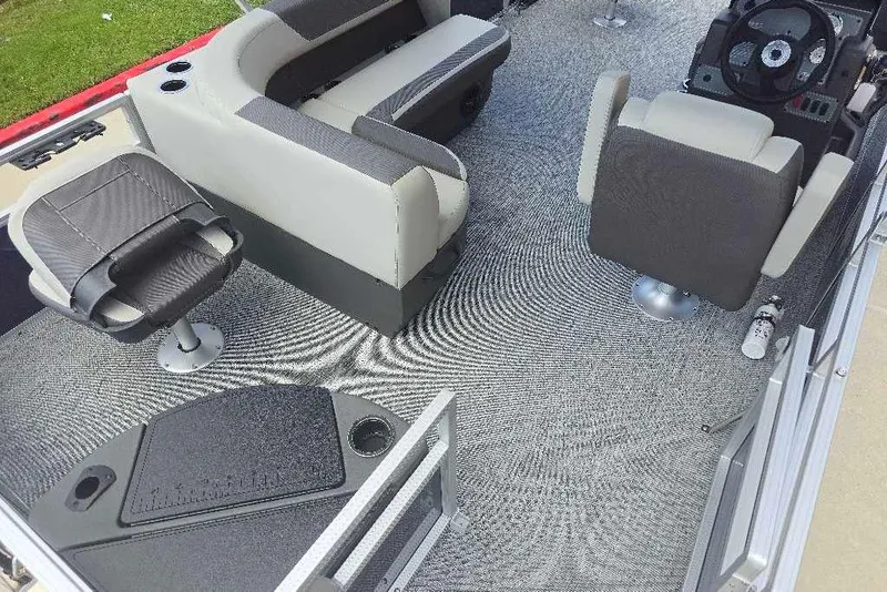 Slide: The Image of 2026 Sun Tracker Bass Buggy 18 DLX interior with seating and steering console. - 9