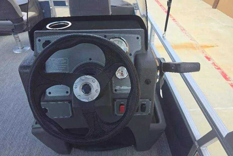 Slide: The Image of Steering console of 2026 Sun Tracker Bass Buggy 18 DLX pontoon boat. - 11