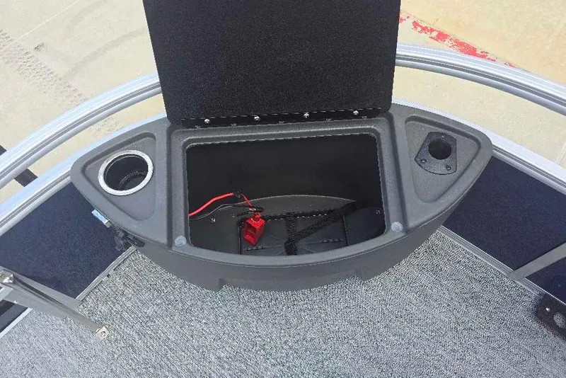 Slide: The Image of Storage compartment on 2026 Sun Tracker Bass Buggy 18 DLX pontoon boat with cup holder. - 12