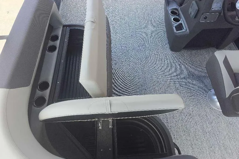 Slide: The Image of Interior of 2026 Sun Tracker Bass Buggy 18 DLX with seating and cup holders. - 14