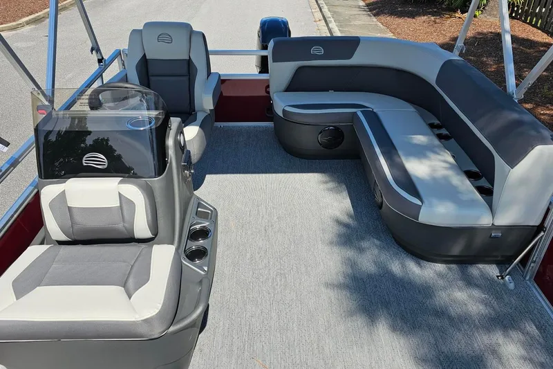 Slide: The Image of 2026 Sun Tracker Bass Buggy 16 XL Select pontoon boat interior with seating and console. - 6