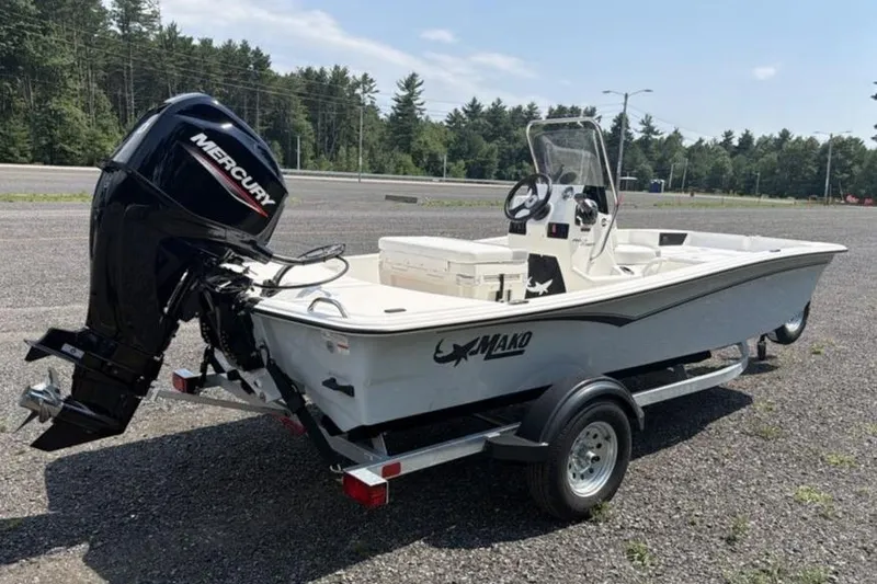 Slide: The Image of 2026 Mako Pro Skiff 15 CC boat on trailer, featuring Mercury outboard motor. - 5
