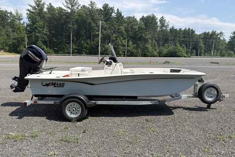 Slide: The Image of 2026 Mako Pro Skiff 15 CC boat on trailer, parked outdoors. - 3