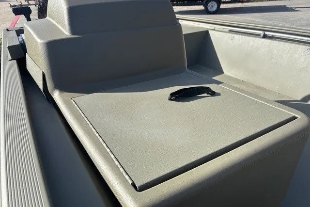 Slide: The Image of 2026 Tracker Grizzly 1648 SC boat interior with storage compartment and handle. - 6