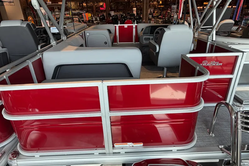 The Image of 2026 Sun Tracker Party Barge 18 DLX interior with red and gray seating. - 0