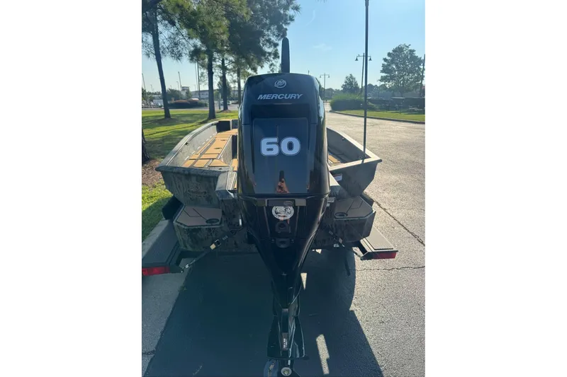 Slide: The Image of 2026 Tracker Grizzly 1756 T Marsh boat with Mercury 60 outboard motor. - 4