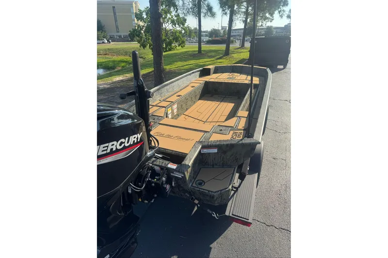 Slide: The Image of 2026 Tracker Grizzly 1756 T Marsh boat with Mercury engine on a trailer. - 2