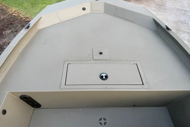 Slide: The Image of 2026 Tracker Grizzly 1754 SC boat interior, featuring a storage compartment and durable design. - 5