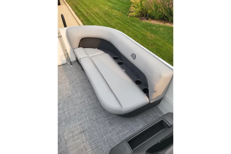 Slide: The Image of 2026 Sun Tracker Party Barge 16 DLX with comfortable seating and cup holders. - 8