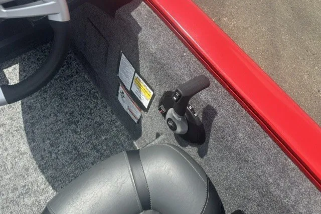 Slide: The Image of Interior of 2026 Tracker Pro Team 175 boat with steering and control panel. - 15