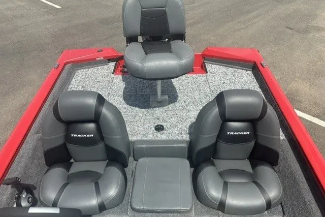 Slide: The Image of 2026 Tracker Pro Team 175 boat interior with three gray seats and red accents. - 20