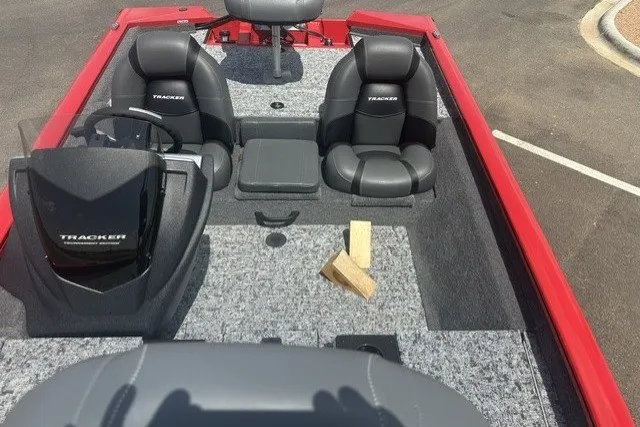 Slide: The Image of 2026 Tracker Pro Team 175 boat interior with dual seats and steering console. - 19