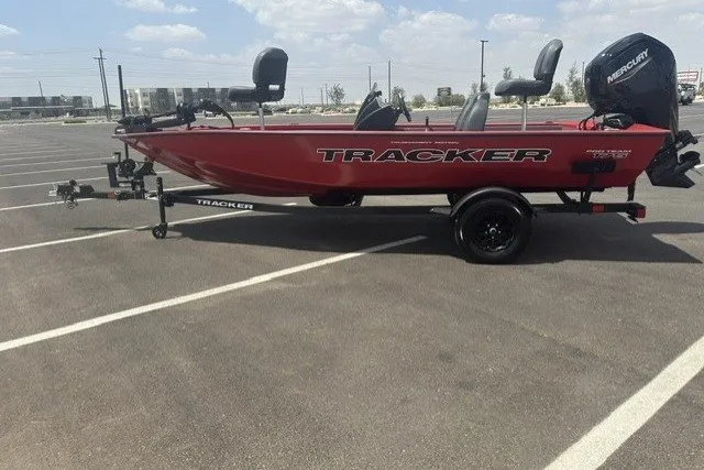 The Image of 2026 Tracker Pro Team 175 boat on trailer in parking lot. - 0