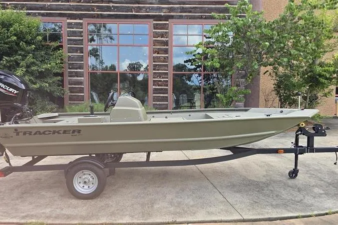 The Image of 2026 Tracker Grizzly 1648 SC boat on trailer, parked outdoors. - 0