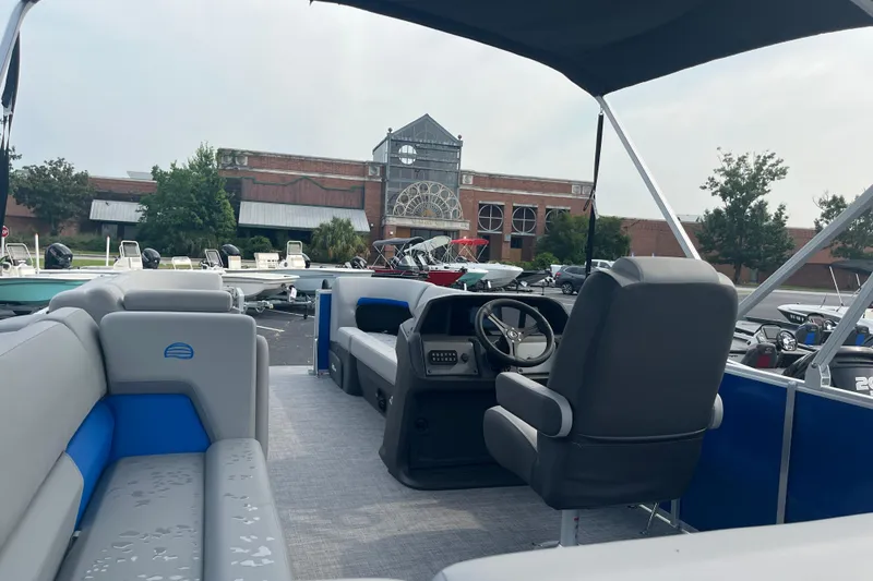 Slide: The Image of 2026 Sun Tracker Party Barge 20 DLX pontoon boat interior at marina. - 6