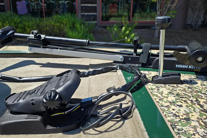 Slide: The Image of 2026 Tracker Bass Tracker Classic Limited with Minn Kota trolling motor on deck. - 5
