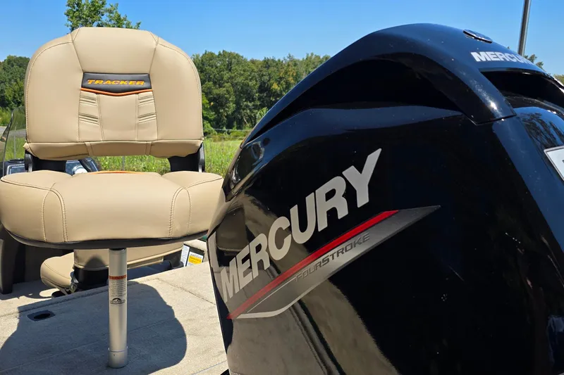 Slide: The Image of 2026 Tracker Bass Tracker Classic Limited boat with Mercury engine and beige seating. - 3