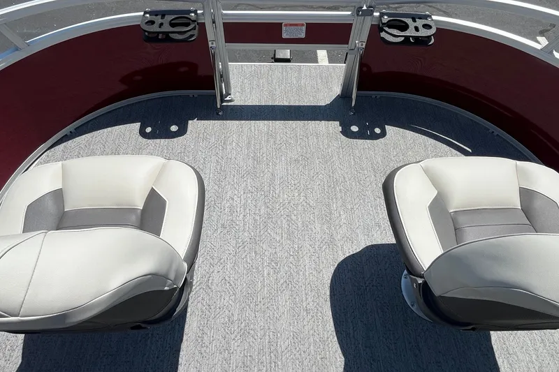 Slide: The Image of 2026 Sun Tracker Bass Buggy 16 XL Select boat interior with two cushioned seats. - 16