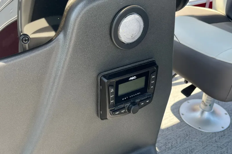Slide: The Image of Control panel and speaker on 2026 Sun Tracker Bass Buggy 16 XL Select boat. - 14