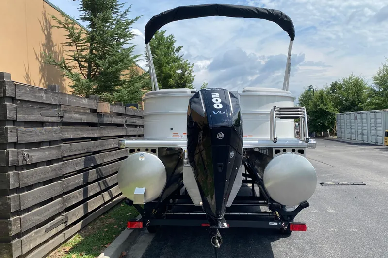 Slide: The Image of 2026 Sun Tracker Party Barge 22 XP3 with powerful 200 V6 engine, parked outdoors. - 4