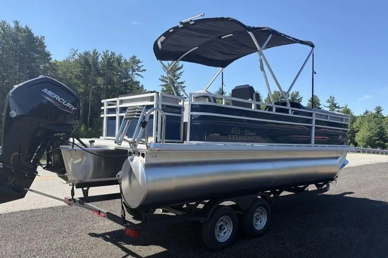 Slide: The Image of 2026 Sun Tracker SportFish 20 DLX pontoon boat with canopy and Mercury outboard motor. - 5