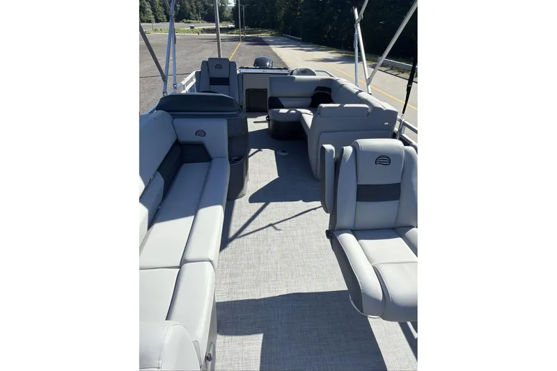 Slide: The Image of 2026 Sun Tracker SportFish 20 DLX pontoon boat interior with spacious seating and modern design. - 8