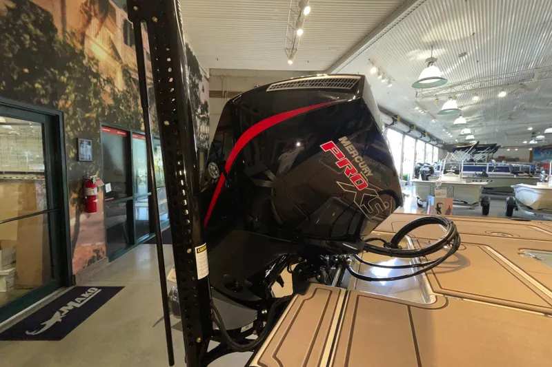 Slide: The Image of 2026 Mako 18 Pro Skiff Backwater Edition with Mercury Pro XS engine in showroom. - 6
