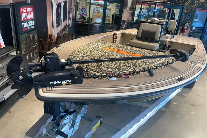 Slide: The Image of 2026 Mako 18 Pro Skiff Backwater Edition with Minn Kota Terrova motor displayed indoors. - 3