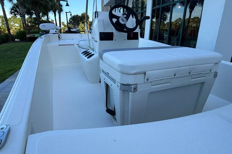 Slide: The Image of 2026 Mako Pro Skiff 15 CC boat interior with steering console and seating. - 6