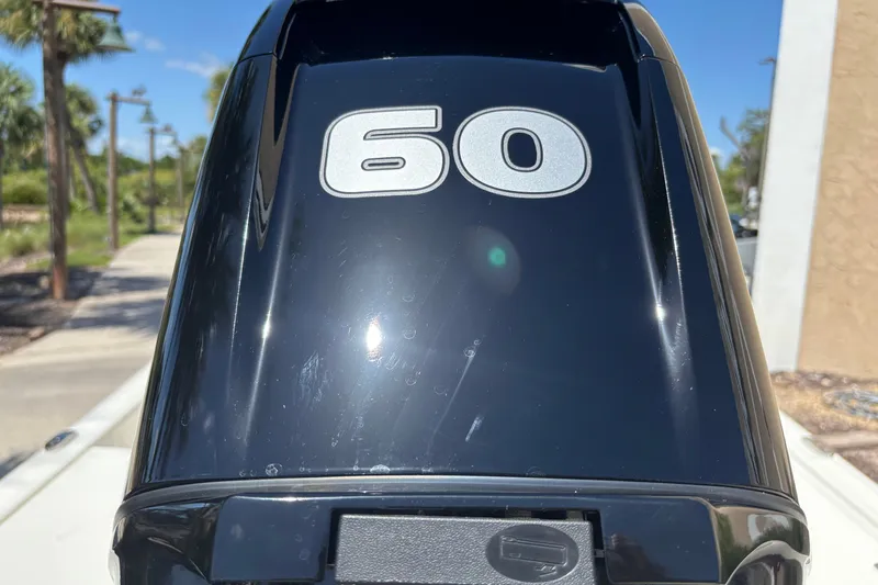 Slide: The Image of Outboard motor with "60" label on a 2026 Mako Pro Skiff 15 CC boat. - 4