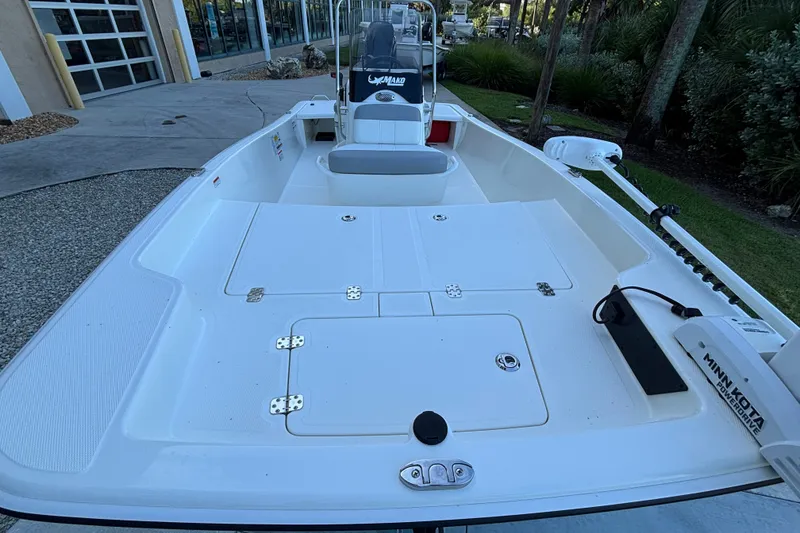Slide: The Image of 2026 Mako Pro Skiff 15 CC boat with spacious deck and Minn Kota trolling motor. - 8
