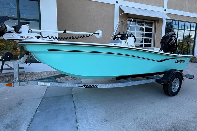 Slide: The Image of 2026 Mako Pro Skiff 15 CC boat on trailer, featuring Minn Kota motor. - 3