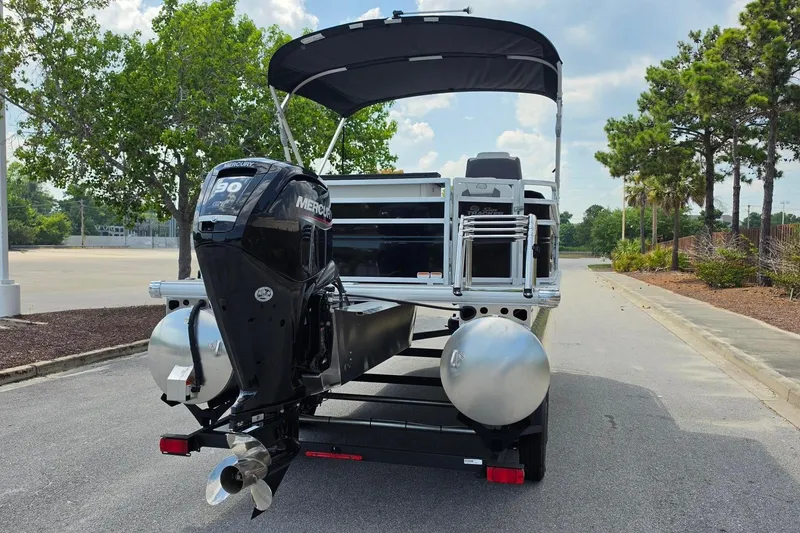 Slide: The Image of 2026 Sun Tracker Fishin' Barge 20 DLX pontoon boat with Mercury outboard motor. - 9