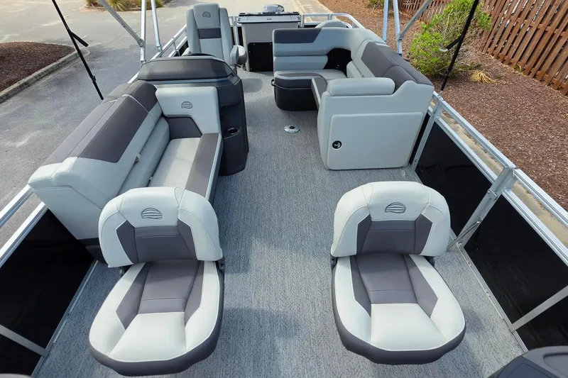 Slide: The Image of 2026 Sun Tracker Fishin' Barge 20 DLX interior with spacious seating and modern design. - 12