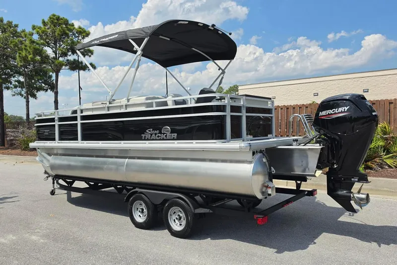 Slide: The Image of 2026 Sun Tracker Fishin' Barge 20 DLX pontoon boat with Mercury outboard motor. - 8