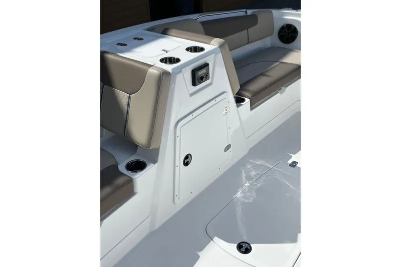 Slide: The Image of Interior of 2026 Tahoe 1950 boat featuring cushioned seating and storage compartments. - 7