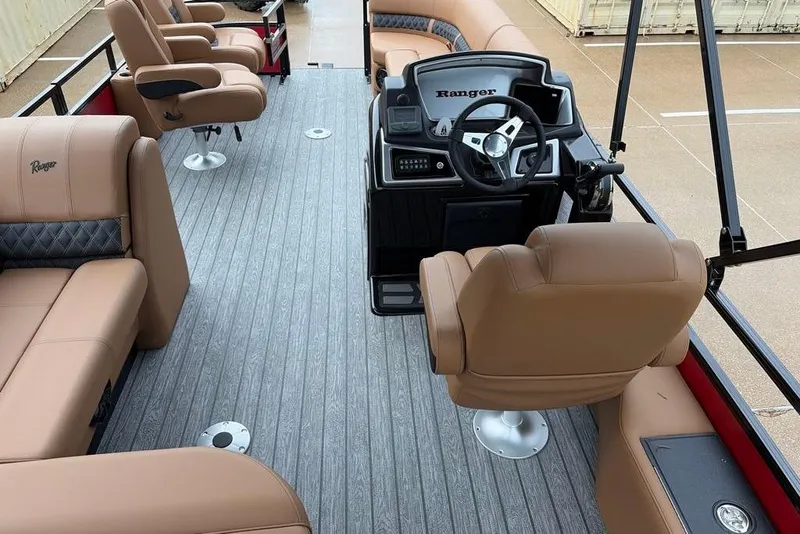 Slide: The Image of Luxurious interior of 2026 Ranger 220FC boat with plush seating and modern helm. - 12