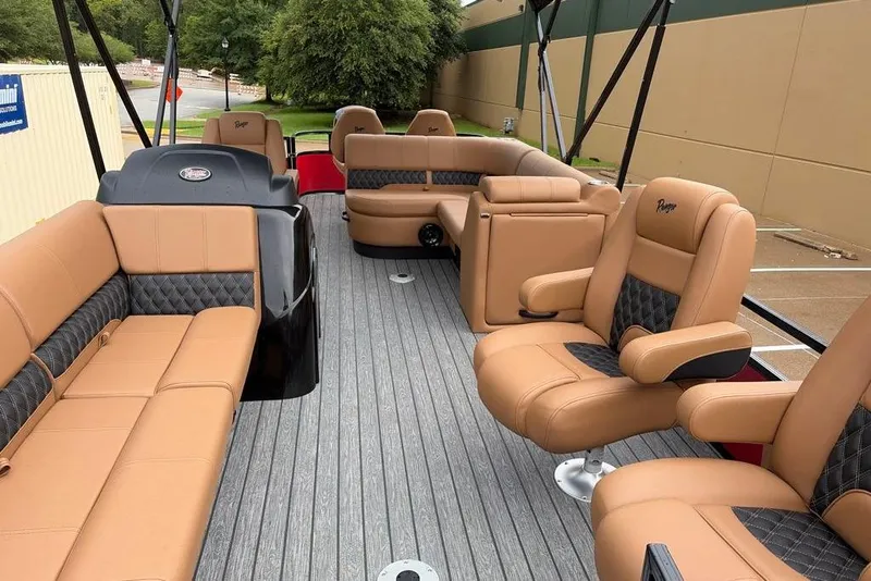 Slide: The Image of Luxurious interior of 2026 Ranger 220FC boat with tan leather seating and modern design. - 5
