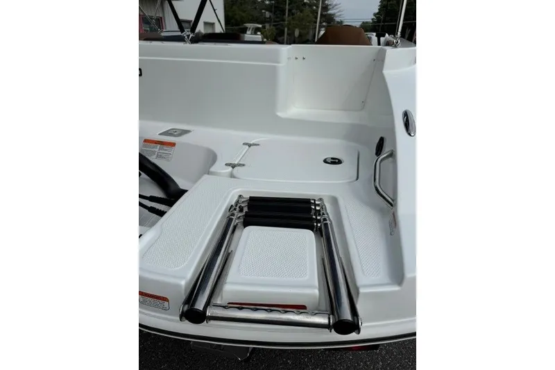 Slide: The Image of 2026 Tahoe 2150 boat with foldable swim ladder on deck. - 20